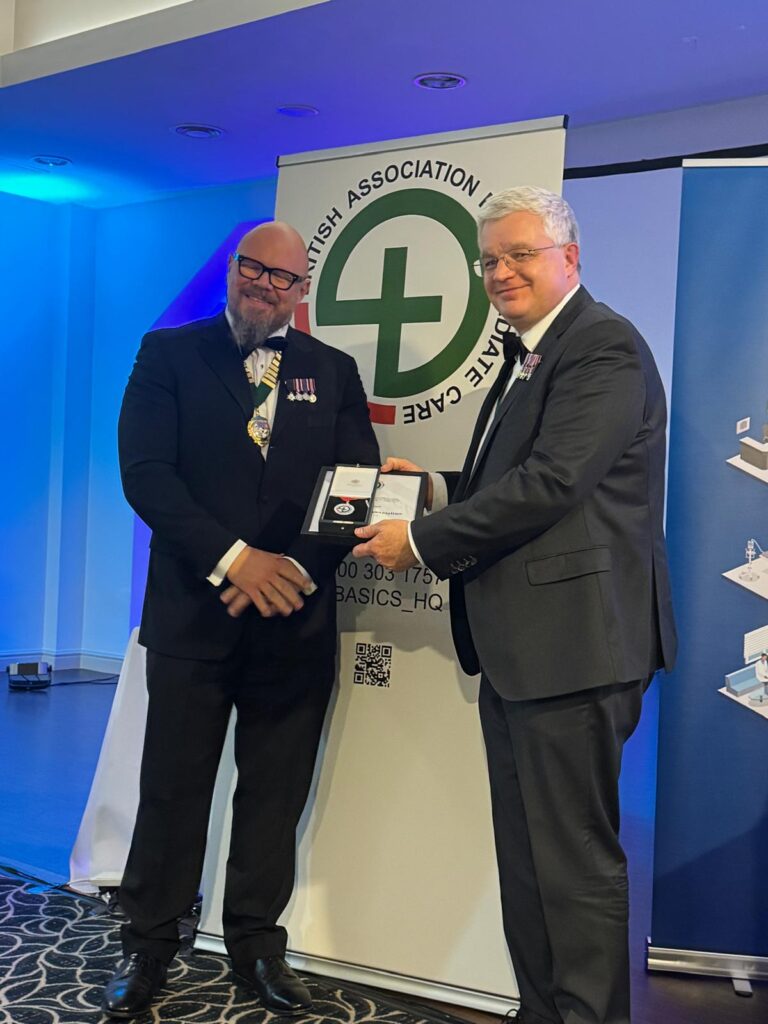 Dr Richard Steyn receives his award from Dr Andy Pountney.
