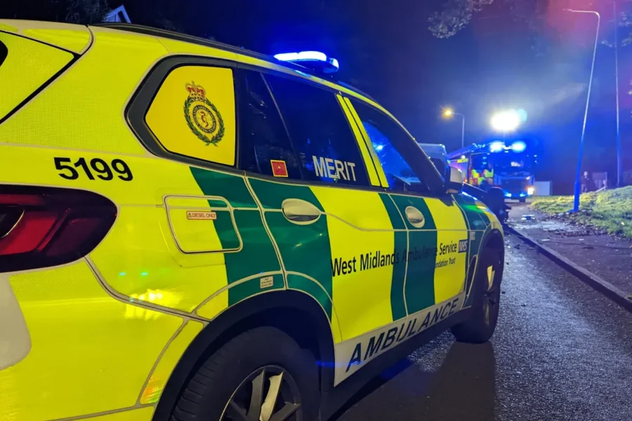 first responder car at night with the lights on and a fire engine in the background with lights on