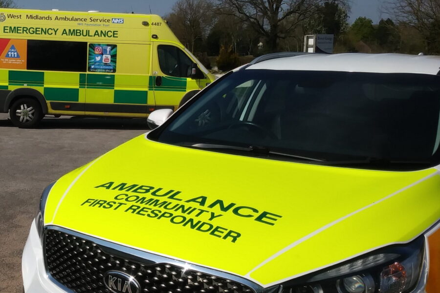 Community First Responder vehicle with ambulance in background