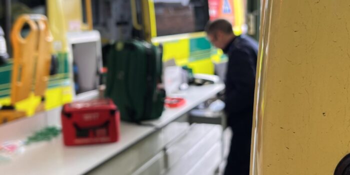 Vehicle preparation operative restocking ambulances in garage