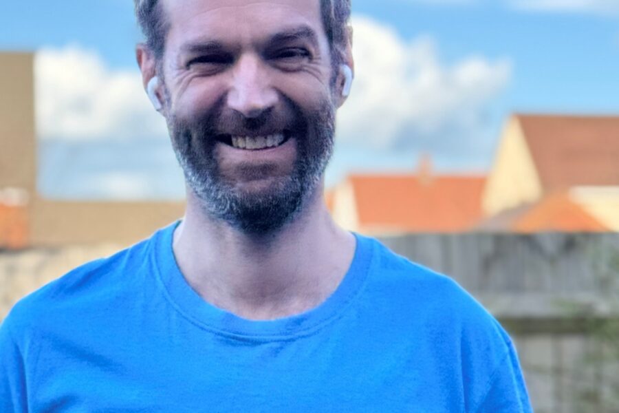 Tim Atherton in a blue Cancer Research UK tshirt